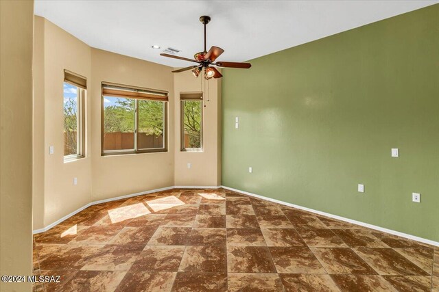 unfurnished room featuring ceiling fan