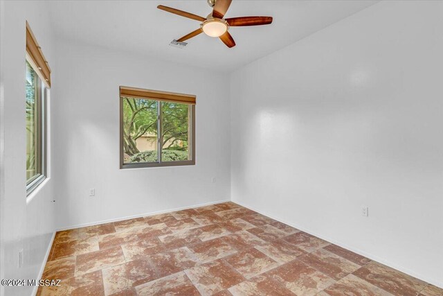 empty room featuring ceiling fan