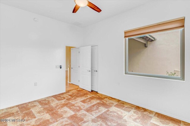 empty room featuring ceiling fan