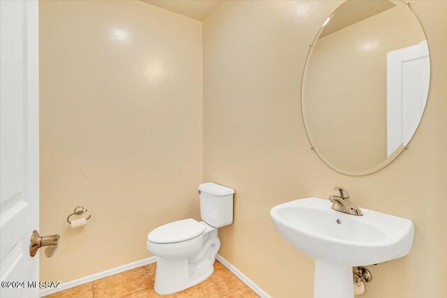 bathroom with tile patterned flooring and toilet