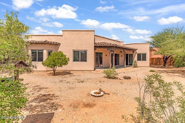 back of property featuring a patio