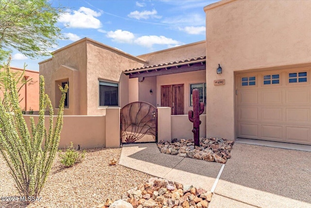 southwest-style home with a garage