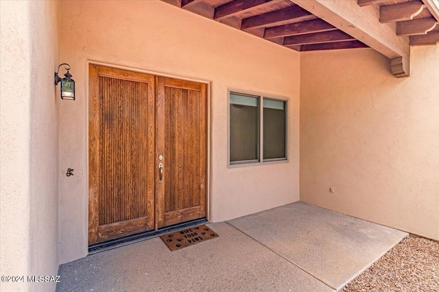 property entrance with a patio area