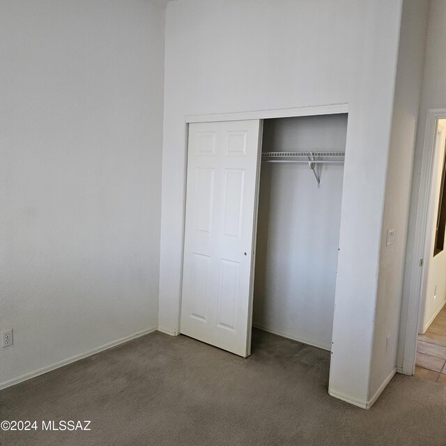 full bathroom featuring toilet, vanity, tile patterned flooring, and shower / bath combo with shower curtain