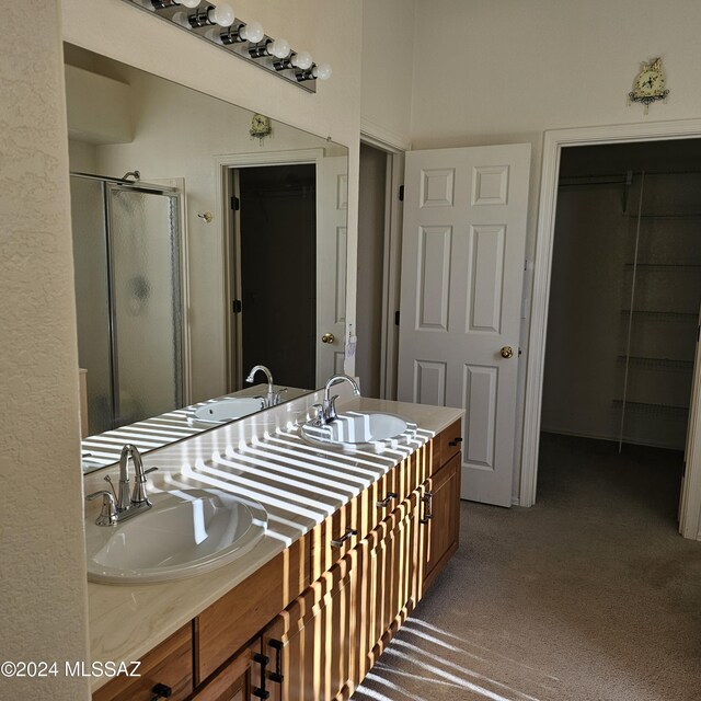 bathroom with vanity, ceiling fan, and a bath