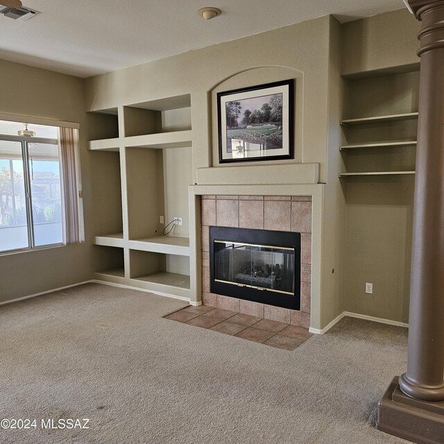 unfurnished living room featuring a textured ceiling, carpet flooring, ceiling fan, and rail lighting