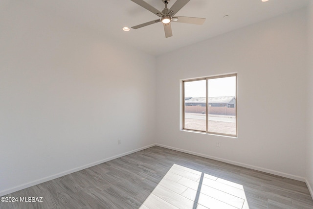 empty room with light hardwood / wood-style flooring and ceiling fan