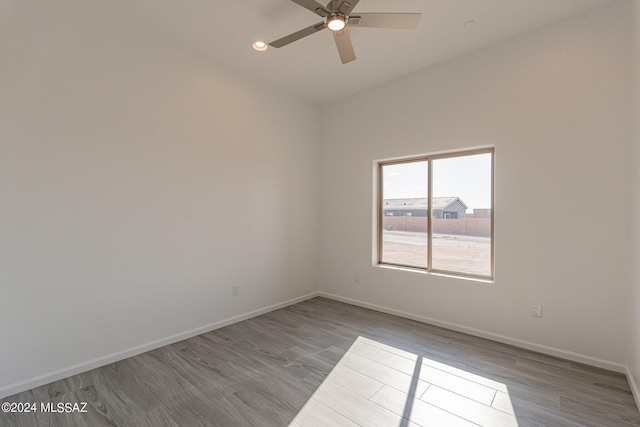 unfurnished room with light wood-type flooring and ceiling fan