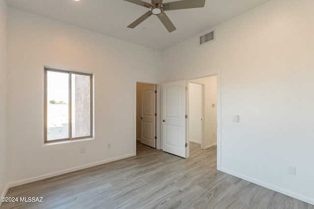 unfurnished room with ceiling fan and light hardwood / wood-style floors