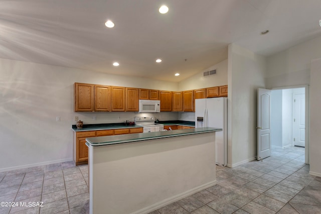 kitchen featuring white appliances, a center island, and high vaulted ceiling