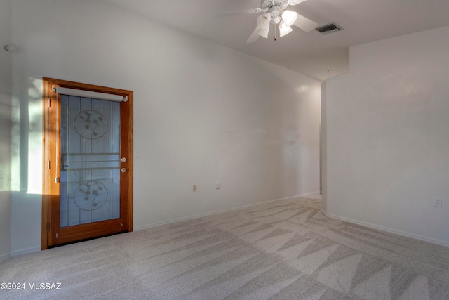 carpeted empty room with ceiling fan