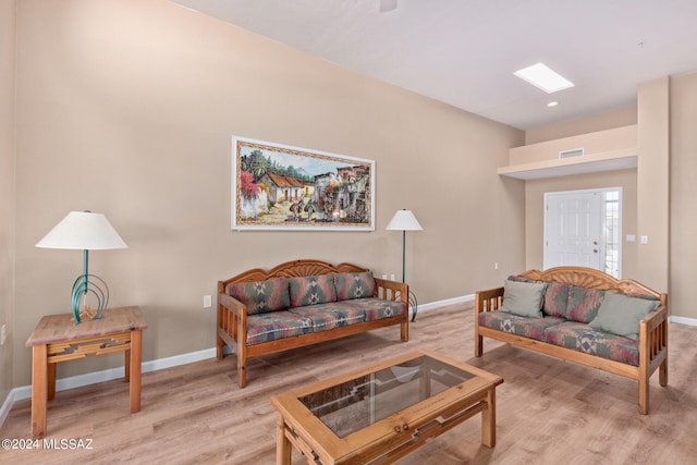 living room with light hardwood / wood-style floors