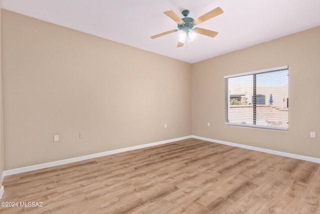 2521 S Pecan Valley Pl, Green Valley, AZ 85614 - spare room featuring light wood-style flooring, baseboards, and ceiling fan