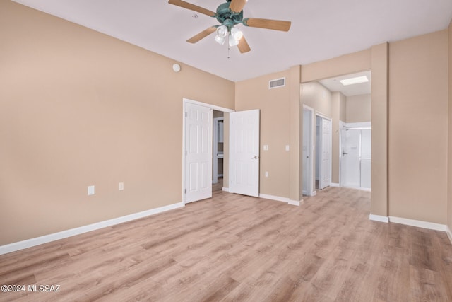 unfurnished bedroom with ceiling fan, connected bathroom, and light hardwood / wood-style floors