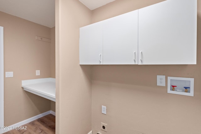 2521 S Pecan Valley Pl, Green Valley, AZ 85614 - washroom featuring cabinet space, hookup for an electric dryer, washer hookup, wood finished floors, and baseboards