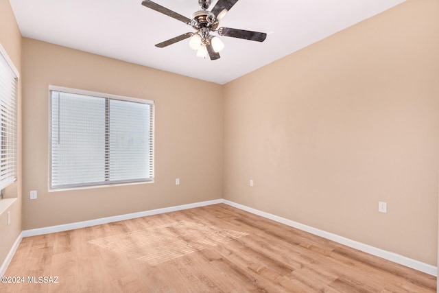 unfurnished room featuring light wood-type flooring and ceiling fan