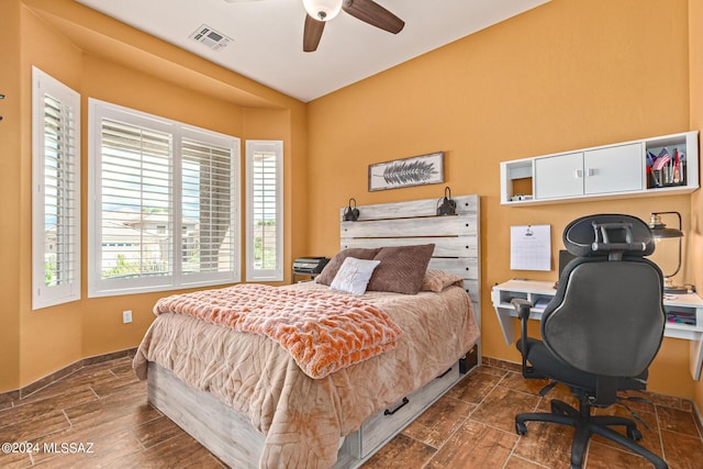 bedroom with ceiling fan and a closet