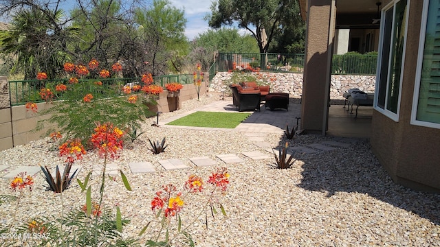 view of yard featuring a patio, outdoor lounge area, and a fenced backyard