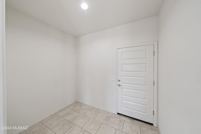 unfurnished room with light tile patterned floors
