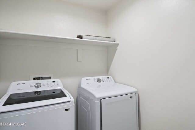 clothes washing area featuring independent washer and dryer