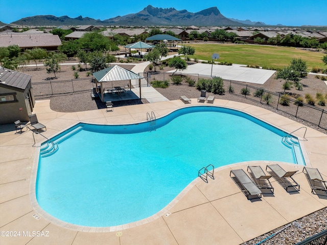 view of pool featuring a gazebo, a patio area, and a mountain view