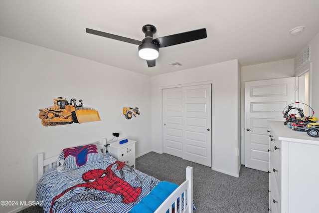 carpeted bedroom with ceiling fan and a closet