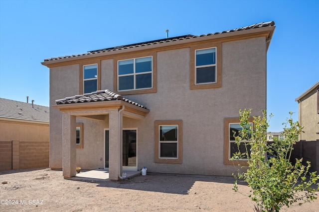 rear view of house with a patio