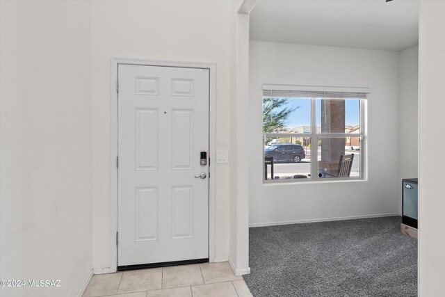 view of carpeted foyer