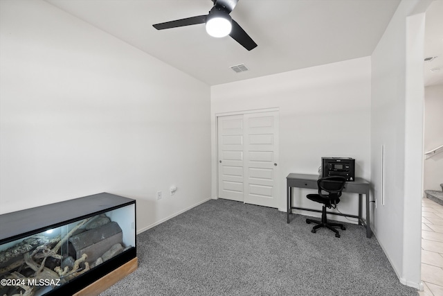 carpeted office with ceiling fan