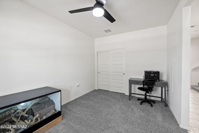 carpeted office featuring baseboards, lofted ceiling, ceiling fan, and visible vents