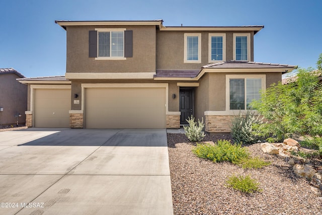 view of front of property featuring a garage