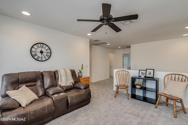 living room with ceiling fan and light colored carpet