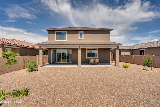 rear view of property with a patio area