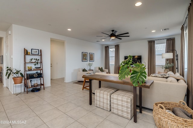 living room with ceiling fan and light tile patterned floors