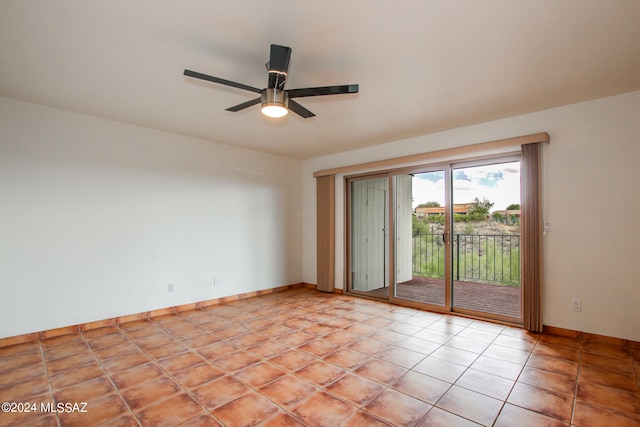 spare room featuring ceiling fan and light tile patterned floors