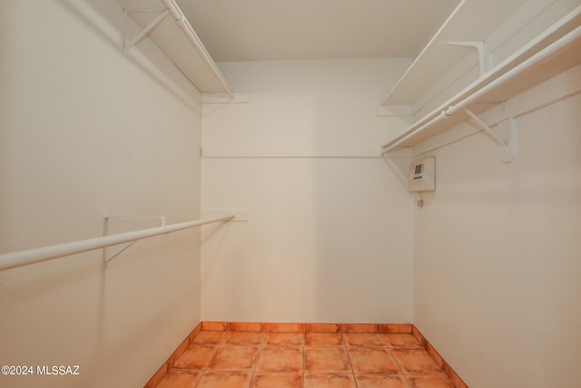 spacious closet with tile patterned flooring