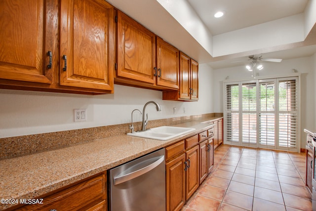 kitchen with ceiling fan, light tile patterned flooring, sink, appliances with stainless steel finishes, and light stone countertops