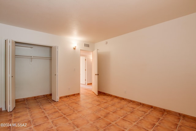 unfurnished bedroom featuring a closet