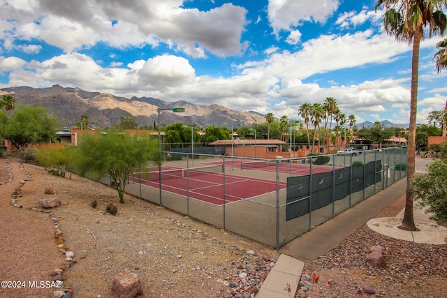 view of sport court with a mountain view