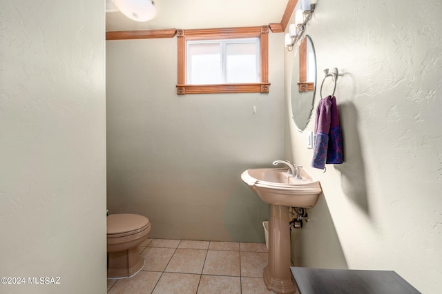 bathroom featuring toilet and tile patterned floors