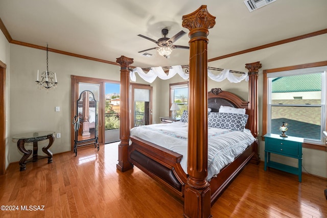 bedroom featuring multiple windows, ceiling fan, hardwood / wood-style floors, and access to exterior