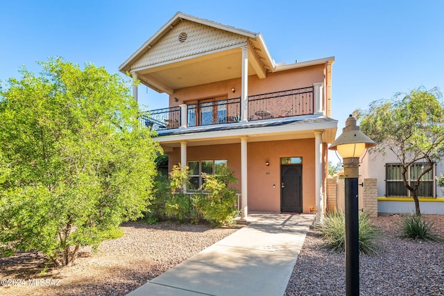 view of front of home with a balcony