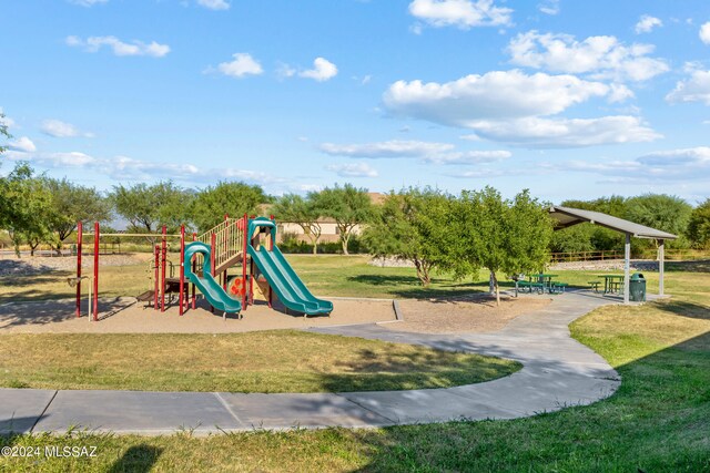 view of playground with a yard