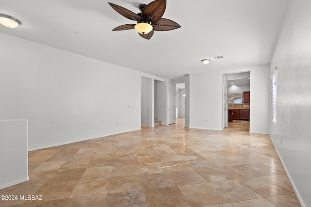 unfurnished room featuring ceiling fan