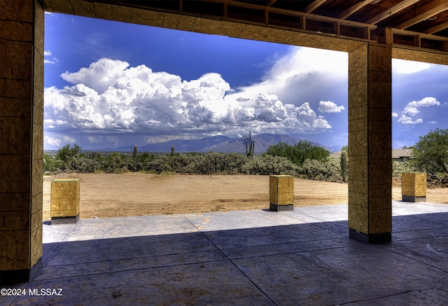 view of patio / terrace featuring a mountain view