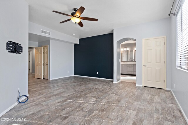 spare room with light hardwood / wood-style flooring and ceiling fan