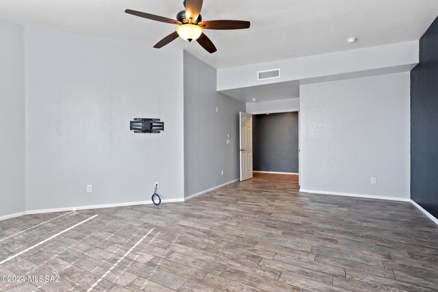 spare room with ceiling fan and hardwood / wood-style floors