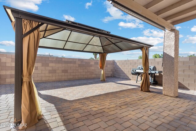 view of patio featuring grilling area and a gazebo