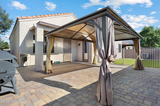 back of house featuring a patio and a gazebo