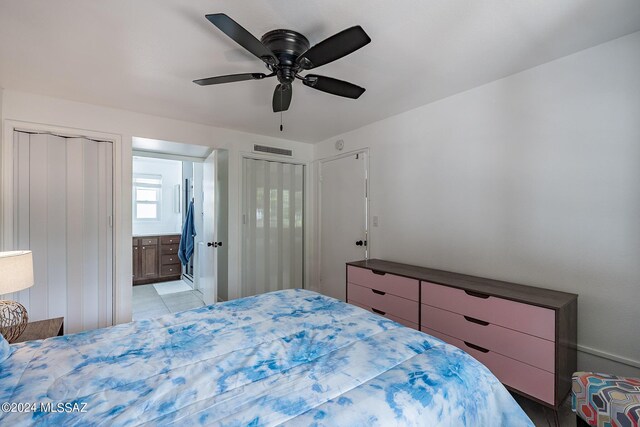 bedroom featuring ensuite bath and ceiling fan